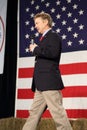 Kentucky Senator Rand Paul speaking in front of flag.