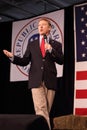 Kentucky Senator Rand Paul speaking in front of flag.