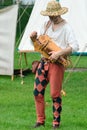 KENTWELL HALL SUFFOLK UK :May 05, 2014: minstrel playing hurdy gurdy