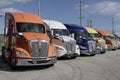 Kenworth Semi Tractor Trailer Big Rig Trucks display at a dealership. Kenworth is owned by PACCAR