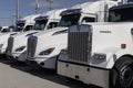 Kenworth Semi Tractor Trailer Big Rig Trucks display at a dealership. Kenworth is owned by PACCAR