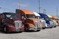 Kenworth Semi Tractor Trailer Big Rig Trucks display at a dealership. Kenworth is owned by PACCAR