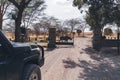 Safari Land Cruiser vehicle enters through the gate at Lake Nakuru National Park to see flamingos