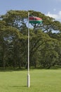 Kenya, flag waves in green grass yard of Karen Blixen Museum and Blixen home in Nairobi, Kenya, Africa Royalty Free Stock Photo