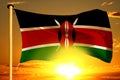 Kenya flag weaving on the beautiful orange sunset with clouds background Royalty Free Stock Photo