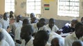 KENYA, KISUMU - MAY 23, 2017: Close-up view of three african boys in uniform sitting in classroom in school