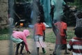 KENYA, KISUMU - MAY 20, 2017: View through the fence. Group of african people spending time outside. Little girl having