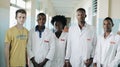 KENYA, KISUMU - MAY 20, 2017: Young beautiful people, women and man in white gown in African hospital.