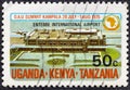 KENYA UGANDA TANZANIA - CIRCA 1975: A stamp printed in Kenya Uganda Tanzania shows OAU Emblem and Entebbe Airport, circa