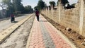 Kenyan roads, bodaboda on local road construction with tile pavements Ziwani in Starehe Constituency in Nairobi Kenya