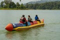 People enjoying water activities on banana boat at the Kenyir Lake, Terengganu