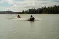 People enjoying water activities on banana boat at the Kenyir Lake, Terengganu