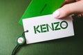 Kenzo logotype on green background.