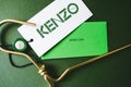 Kenzo logotype on green background.