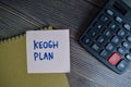 Keogh Plan write on sticky notes isolated on Wooden Table Royalty Free Stock Photo