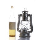 Keosin bottle and old twentieth century kirosin lamp on a white background Royalty Free Stock Photo