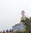 People bringing religious offers to divine statue