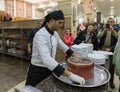 The cook is preparing to remove the pan and leave the dish - Maqluba - on a tray in a roadside shop - restaurant on the intercity