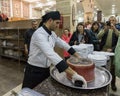 The cook is preparing to remove the pan and leave the dish - Maqluba - on a tray in a roadside shop - restaurant on the intercity