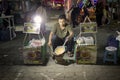 Kerak Telor seller is cooking for buyer at night market, typical food of Betawi, located on Solo city