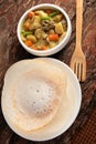 Kerala cuisine-Soft Appam served with hearty mutton stew Royalty Free Stock Photo