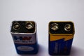 07/06/2020- Kerala,India: Close-up of an old leaked 9V dry cell battery of HW brand and a new 9V dry cell battery of Goldmen brand