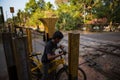 Indian boy on a Bicycle crosses the railway.