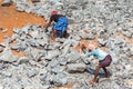 KERALA, INDIA - MARCH 10, 2018: Workers break stones with hammers. With selective focus