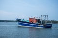 Indian blue fishing boat sails on the sea