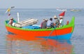 Indian fishermen catching fish for food in wooden boats in Arabian sea, Kerala, South India