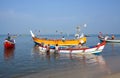 Indian fishermen catching fish for food in wooden boats in Arabian sea, Kerala, South India