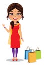 Indian woman wearing a salwar kameez suit with shopping bags - Vector Royalty Free Stock Photo