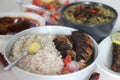 Kerala meals with red rice, sardines curry, sardine fry and coconut based green gram curry Royalty Free Stock Photo