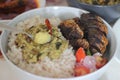 Kerala meals with red rice, sardines curry, sardine fry and coconut based green gram curry Royalty Free Stock Photo