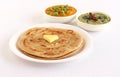 Kerala Paratha with Butter Topping and Side Dishes