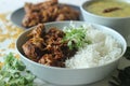 Kerala style dry chicken roast and lentil curry prepared with fenugreek leaves served with basmati rice. A healthy combination Royalty Free Stock Photo