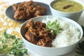 Kerala style dry chicken roast and lentil curry prepared with fenugreek leaves served with basmati rice. A healthy combination Royalty Free Stock Photo