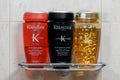 Kerastase Paris hair shampoo bottles closeup on bath stand.