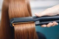 Keratin recovery straighten hair with professional iron tool Royalty Free Stock Photo