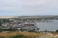 Kerch, Crimea - Jane 24, 2018: View from Mount Mithridates to the sea trading port. Dry cargo ship enters port water area