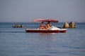 Kerch, Ukraine-August 06, 2018: Holidaymakers ride on a water bike