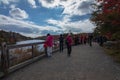 Tourists enjoy taking photos near the visitor center at overlooking Lake Minnewaska