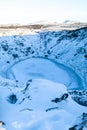 Kerid lake frozen in winter in the crater of an extinct volcano. Incredible iceland landscape in winter Royalty Free Stock Photo