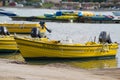 Yellow rental boats on the shore Royalty Free Stock Photo