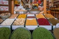 Kerman, Iran - 04.19.2019: Colorful grains and spices in front of a spice shop in persian bazaar.