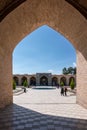 Kerman, Iran - 19.04.2019: People walking around and sitting in the square and bazaar crossroads in the city of Kerman