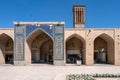 Kerman, Iran - 19.04.2019: People walking around and sitting in the square and bazaar crossroads in the city of Kerman