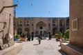 Kerman, Iran - 19.04.2019: People walking around and sitting in the square and bazaar crossroads in the city of Kerman