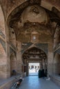 Kerman, Iran - 19.04.2019: People walking around and sitting in the square and bazaar crossroads in the city of Kerman