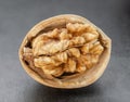 Kernel walnut on dark background. Royalty Free Stock Photo